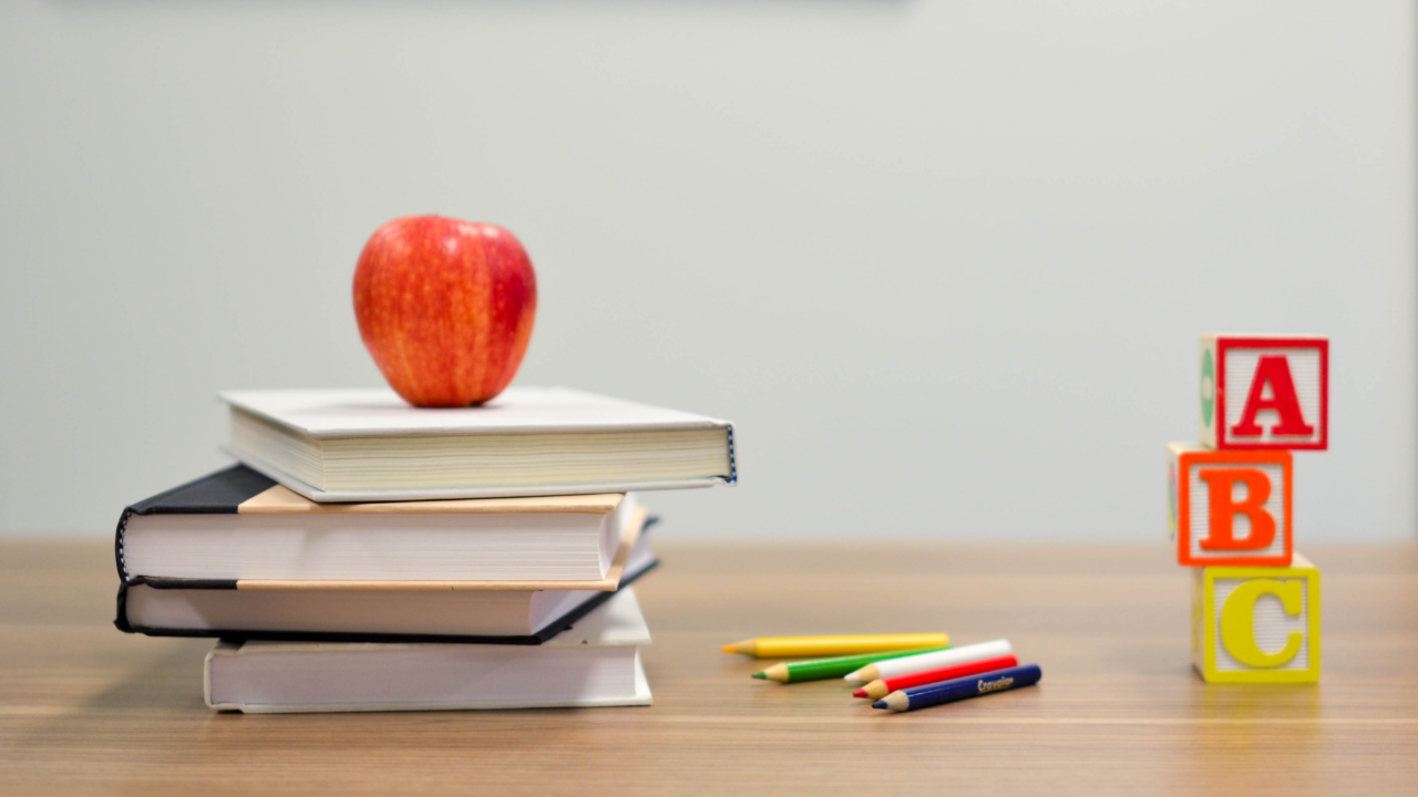apple on top of books